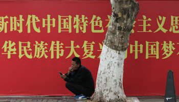 A man smokes a cigarette in Yunnan Province, China, 2018 (Reuters/Wong Campion)