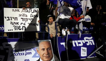 Supporters of Prime Minister Binyamin Netanyahu protest following his indictment, November 21 (Reuters/Ronen Zvulun)