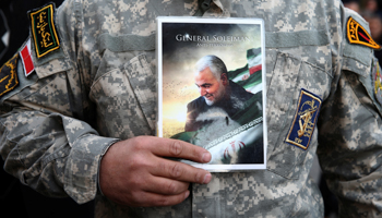 A demonstrator holds the picture of Qassem Soleimani during a protest against the assassination, Tehran, Iran January 3, 2020 (Reuters/Nazanin Tabatabaee)