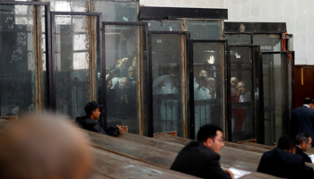 Muslim Brotherhood members are seen behind bars during a court session in Cairo, Egypt, December 2, 2018 (Reuters/Amr Abdallah Dalsh)