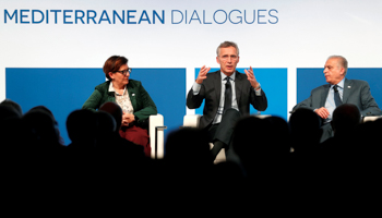Italy's defence minister (L) and Iraq’s foreign minister (R) flank NATO Secretary General Jens Stoltenberg at the Mediterranean summit in Rome, November 2018 (Reuters/Max Rossi)