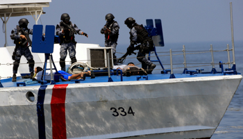 The Philippine Coast Guard arresting mock pirates in a training exercise (Reuters/Romeo Ranoco)