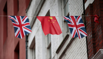 Chinese and UK flags fly in London's Chinatown (Reuters/Suzanne Plunkett)