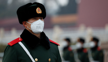 A paramilitary officer wearing a face masks stands guard at the Tiananmen Gate, as the country is hit by an outbreak of the new coronavirus, in Beijing, China January 27, 2020 (Reuters/Carlos Garcia Rawlins)