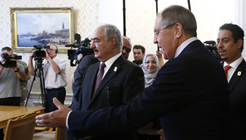 Russian Foreign Minister Sergey Lavrov (R) shows Libyan strongman Khalifa Haftar to his seat at a 2017 meeting in Moscow (Reuters/Sergei Karpukhin)