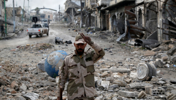 A Syrian army soldier gestures in Maarat al-Numan, Syria, January 30, 2020 (Reuters/Yamam Al Shaar)