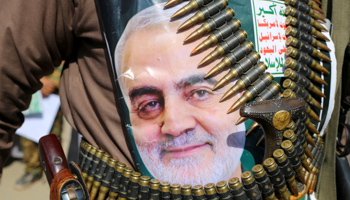 A Huthi supporter with poster of Iranian commander Qassem Soleimani, during a rally to denounce the US killing, in Saada, Yemen, January 6 (Reuters/Naif Rahma)