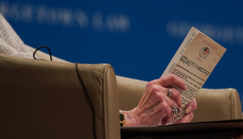 US Supreme Court Justice Ruth Bader Ginsburg holds a copy of the US Constitution in Washington, DC, US, September 12, 2019. (Reuters/Sarah Silbiger)