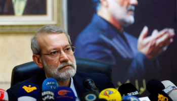 Outgoing Iranian parliamentary speaker Ali Larijani, with a picture of the late IRGC senior commander Qassem Soleimani in the background, Lebanon, February 17 (Reuters/Mohamed Azakir)