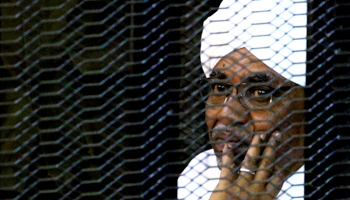 Former President Omar al-Bashir sits in a cage while in court facing corruption charges, Khartoum, September 28, 2019 (Reuters/Mohamed Nureldin Abdallah)