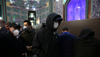 Men wear face masks during parliamentary elections at a polling station in Tehran, Iran February 21, 2020 (Reuters/Nazanin Tabatabaee)