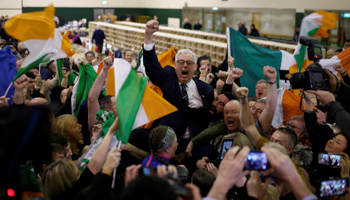 Sinn Fein candidate Thomas Gould celebrates with supporters after the announcement of voting results, during Ireland's national election, in Cork, Ireland, February 9, 2020 (Reuters/Henry Nicholls)