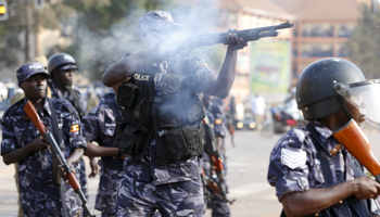 Police disperse an opposition rally ahead of the 2016 elections (Reuters/James Akena)