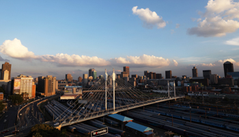 The city of Johannesburg and Nelson Mandela bridge, with trains parked underneath, November 29, 2018 (Reuters/Siphiwe Sibeko)