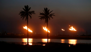 Flames emerge from flare stacks at Nahr Bin Umar oil field, north of Basra, Iraq (Reuters/Essam Al)