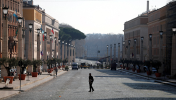 A man crosses street in Rome (Reuters/Yara Nardi)