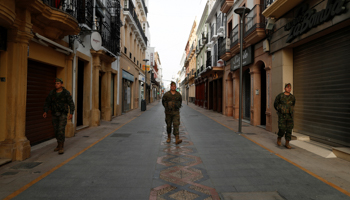 Spanish legionnaires patrol an empty street during partial lockdown in the city of Ronda, Spain, March 18 (Reuters/Jon Nazca)