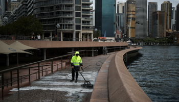 The waterfront in Sydney is cleaned as COVID-19 spreads (Reuters/Loren Elliott)