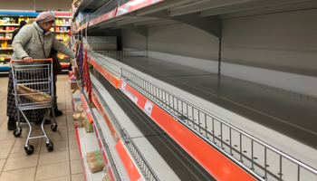 Empty shelves in the cereal section of a Moscow supermarket (Reuters/Evgenia Novozhenina)