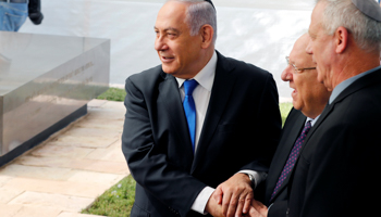 Prime Minister Binyamin Netanyahu, President Reuven Rivlin and opposition leader Benny Gantz greet one another (Reuters/Ronen Zvulun)
