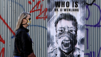 A poster of Li Wenliang, the Chinese doctor who died in Wuhan after blowing the whistle on the pandemic, Prague, March 27 (Reuters/David W Cerny)
