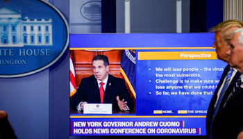 President Donald Trump and Vice President Mike Pence watch a video of New York governor Andrew Cuomo speaking about COVID-19, Washington, United States, April 19 (Reuters/Al Drago)