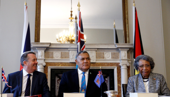 Britain's International Trade Secretary Liam Fox, Jitoko Tikolevu, Fiji High Commissioner to the UK and Winnie Kiap, Papua New Guinea High Commissioner to the UK (Reuters/Henry Nicholls)