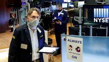 Traders wearing masks at the New York Stock Exchange (NYSE) in New York, U.S., May 26 (Reuters/Brendan McDermid)