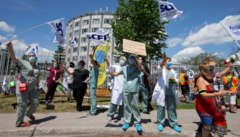 Health care workers, professionals and unions demanding safer working conditions and time off amid the COVID-19 outbreak, protest in front of Santa Cabrini Hospital in Montreal, Quebec, Canada, May 29 (Reuters/Christinne Muschi)
