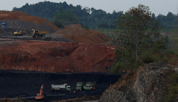 Machines at work at a coal mine in East Kalimantan province (Reuters/Beawiharta)