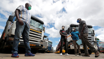 Truck drivers await COVID-19 test results amid major backlogs at the Kenya-Tanzania border, May 12 (Reuters/Thomas Mukoya)