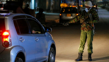 A police officer stops a car amid lockdown restrictions in Nairobi, Kenya, May 6 (Reuters/Thomas Mukoya)
