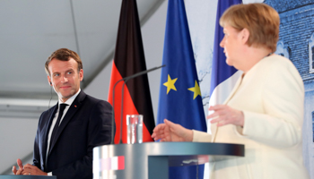 German Chancellor Angela Merkel and French President Emmanuel Macron (Reuters/Hayoung Jeon)