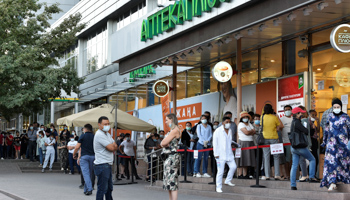 A queue outside a pharmacy in Almaty, Kazakhstan (Reuters/Mariya Gordeyeva)