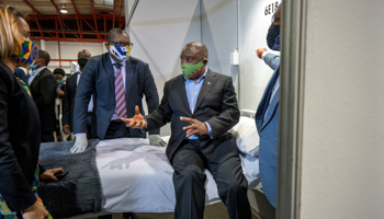 South African President Cyril Ramaphosa visits the COVID-19 treatment facilities at the NASREC Expo Centre in Johannesburg, April 24 (Reuters/Jerome Delay)