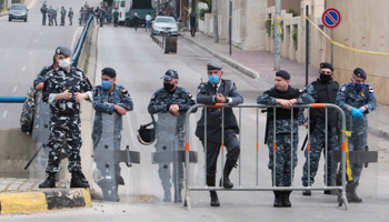 Lebanese police standing guard during a protest under COVID-19 lockdown (Reuters/Aziz Taher)