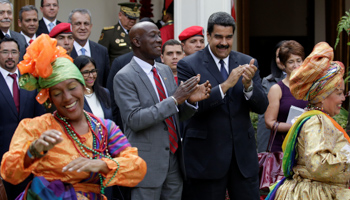 Prime Minister Keith Rowley (left) and Venezuelan President Nicolas Maduro at the signing of a hydrocarbons agreement (Reuters/Marco Bello)