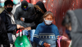People queuing outside a soup kitchen in Buenos Aires (Reuters/Agustin Marcarian)