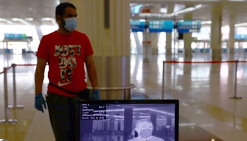 COVID-19 temperature screening at Dubai International Airport (Reuters/Ahmed Jadallah)