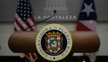 The governors' podium and crest, San Juan, Puerto Rico, July 7 (Reuters/Ricardo Arduengo)