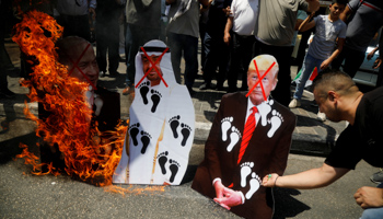 West Bank Palestinians burn cutouts of leaders involved in the UAE-Israel deal (Reuters/Raneen Sawafta)