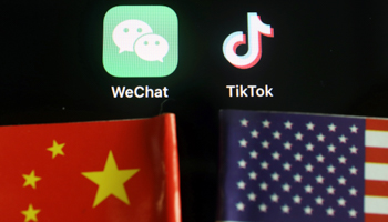 US President Donald Trump has issued two executive orders that target Chinese-owned apps WeChat and TikTok (Reuters/Florence Lo)