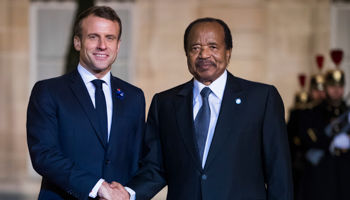 French President Emmanuel Macron (L) welcomes Cameroon’s President Paul Biya (R) for a dinner held with participants of the Paris Peace Forum, Elysee Palace, Paris, November 11, 2019 (Christophe Petit Tesson/EPA-EFE/Shutterstock)