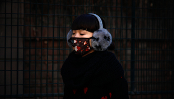 A woman wearing a face mask in Beijing (Reuters/David Gray)