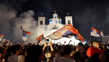 Opposition supporters celebrate their win election outside the Cathedral of the Resurrection of Christ, Podgorica, August 31 (Reuters/Stevo Vasiljevic)