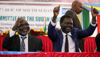 Rebel leaders Gibril Ibrahim and Minni Minnawi celebrate the signing of the peace deal, August 31 (Reuters/Samir Bol)