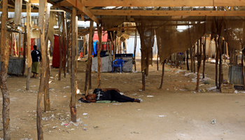  A man sleeps in an empty market area closed due to COVID-19 concerns, Mogadishu, Somalia (Reuters/Feisal Omar)