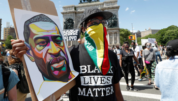 A man wearing a Guyanese flag at a Caribbean-led Black Lives Matter protest in New York (Shutterstock/Kathy Willens/AP)