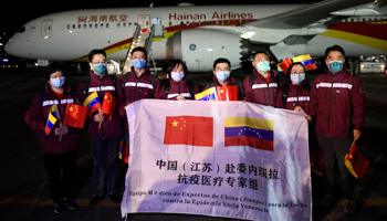 Chinese medical personnel arriving in Caracas with COVID-related medical supplies (Matias Delacroix/AP/Shutterstock)