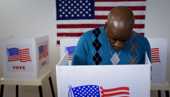 A voter casts their vote (vesperstock/Shutterstock)